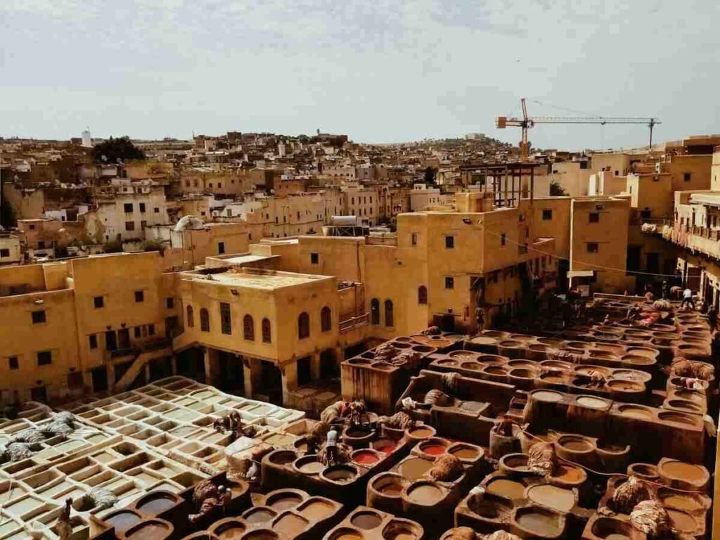 One of the must-see places to visit in Morocco, the Chouara Tannery in Fez shows traditional leather dyeing vats.