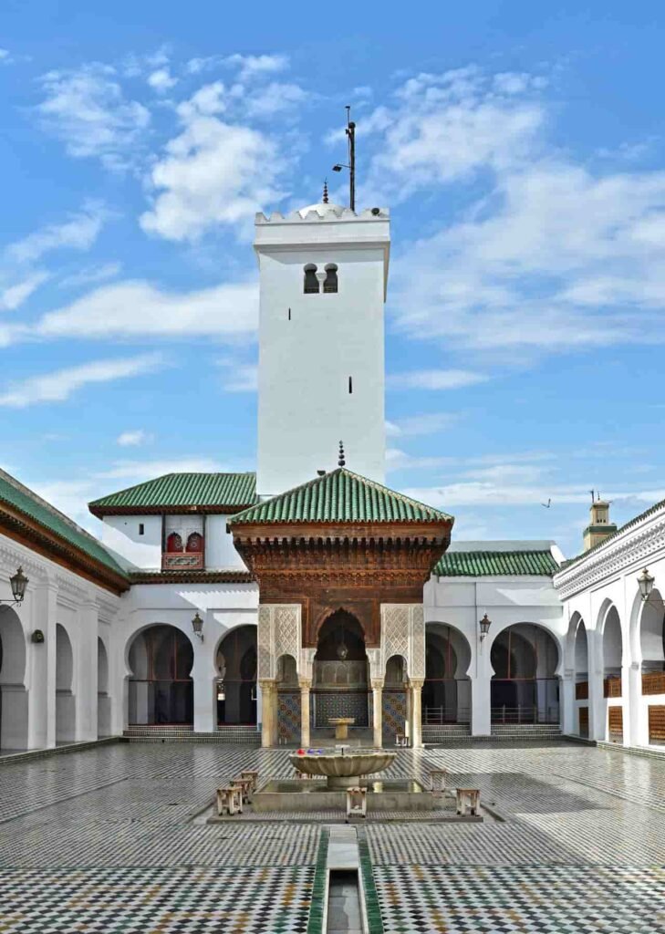 Historic Al Quaraouiyine Mosque and University in Fes Medina with green tiled roof and Islamic architecture